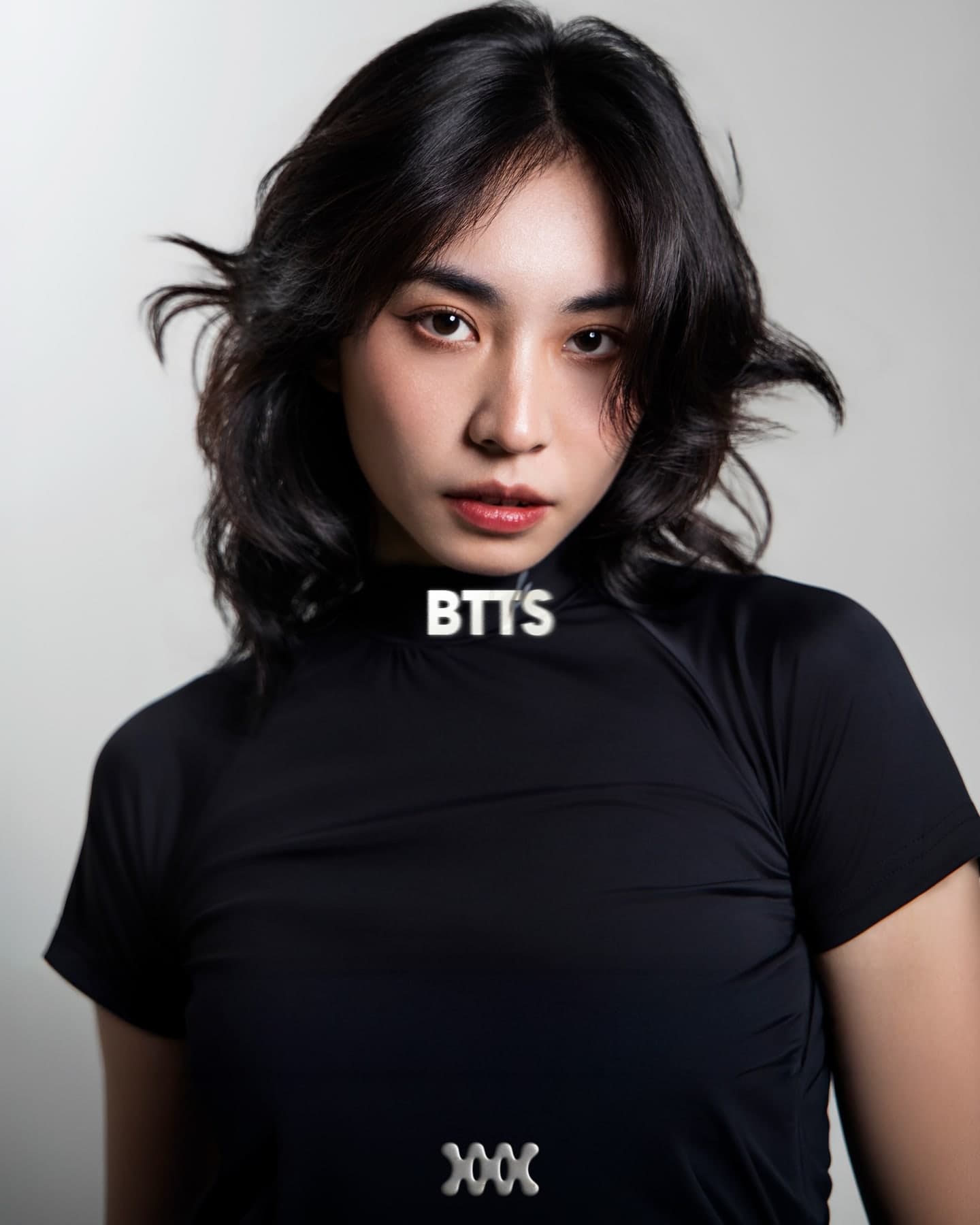 Studio portrait of BTTS on grey, name over the chest